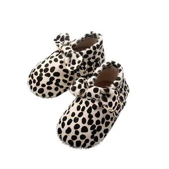 Black and white animal print baby moccasins with bow design